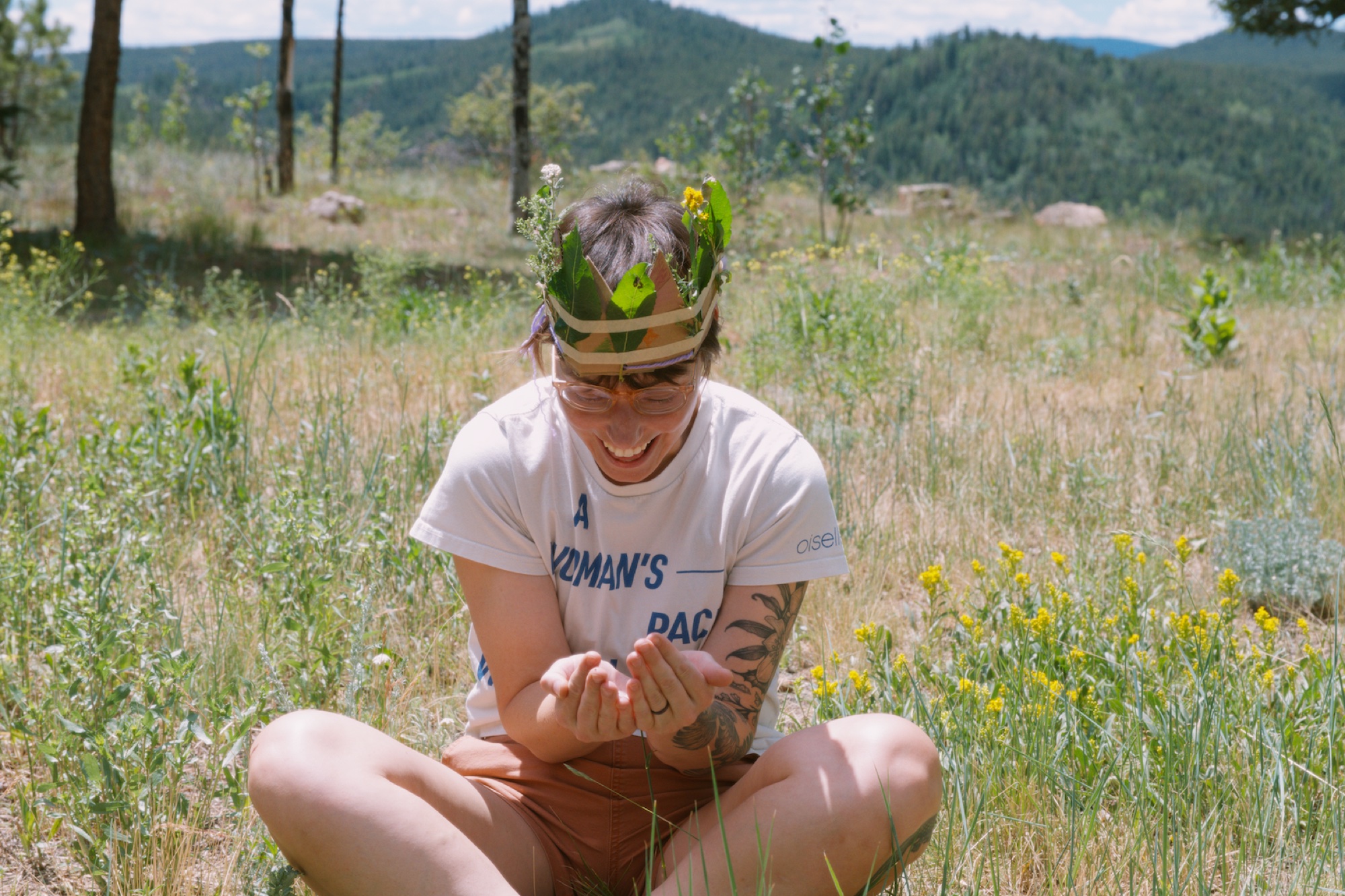 Wearing a leafy nature crown in a mountain meadow