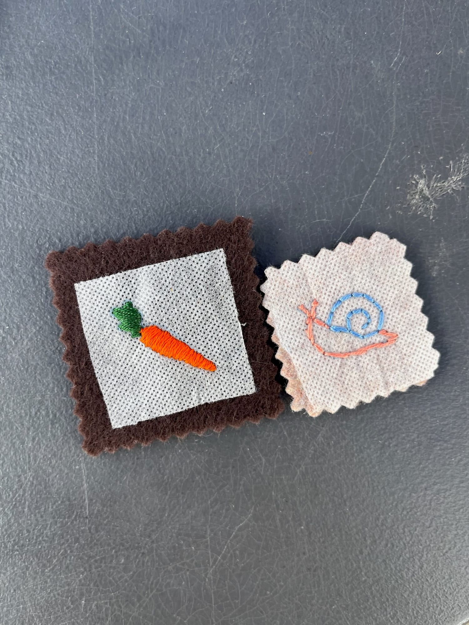 A carrot and a snail finished by two young makers